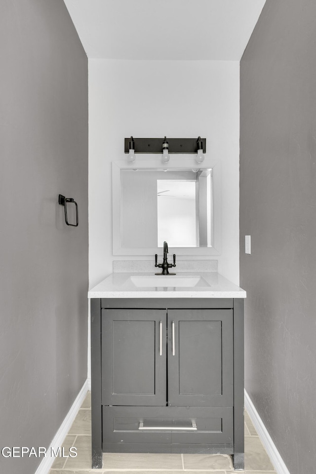 bathroom with vanity and wood-type flooring