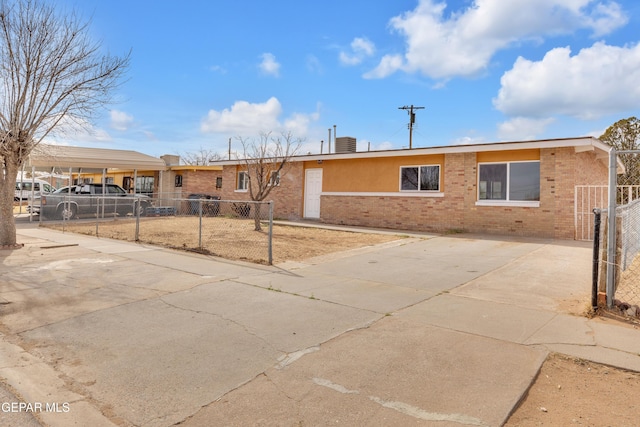 ranch-style home with a carport