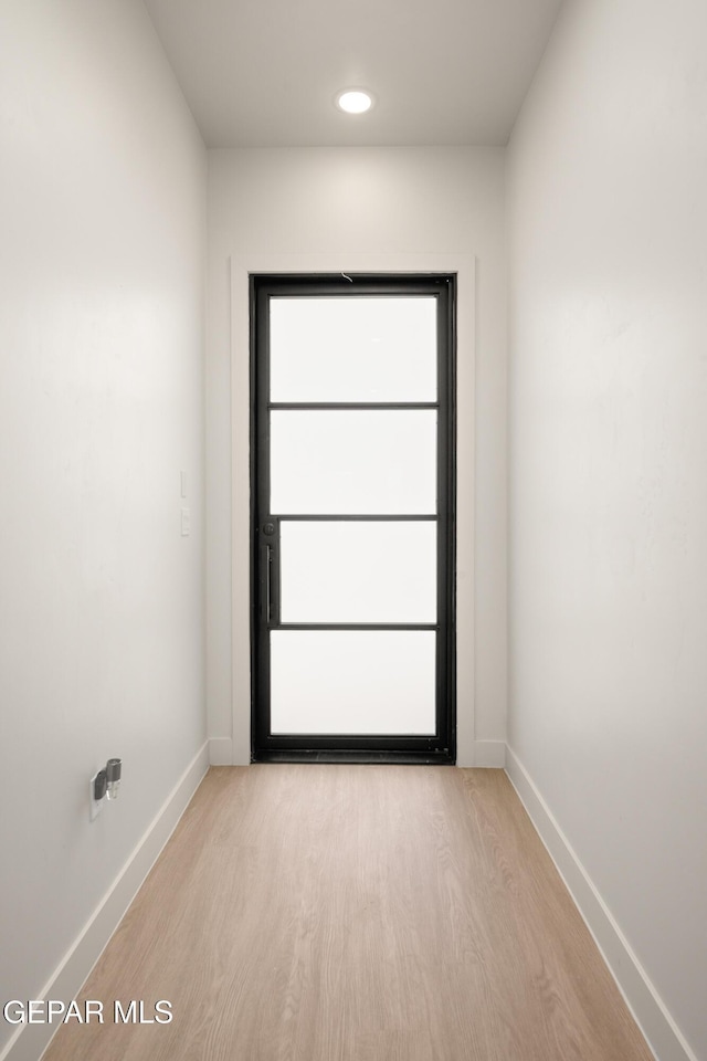 doorway to outside featuring light hardwood / wood-style floors