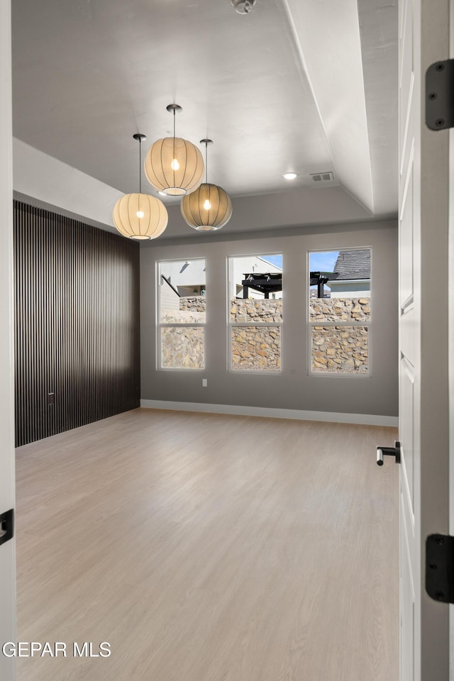 spare room featuring light hardwood / wood-style flooring