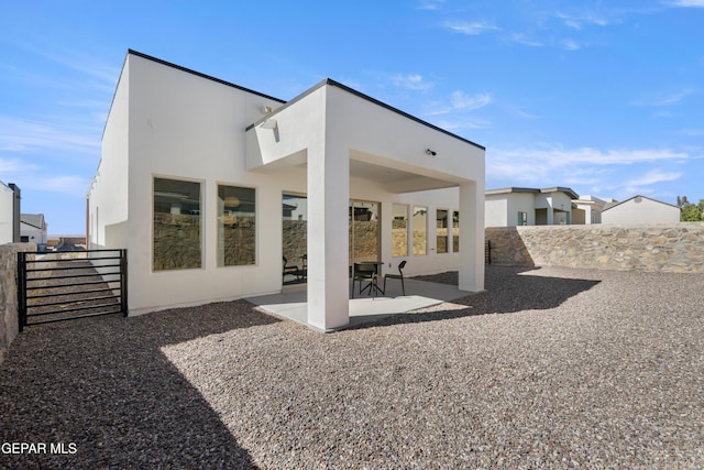 rear view of house with a patio