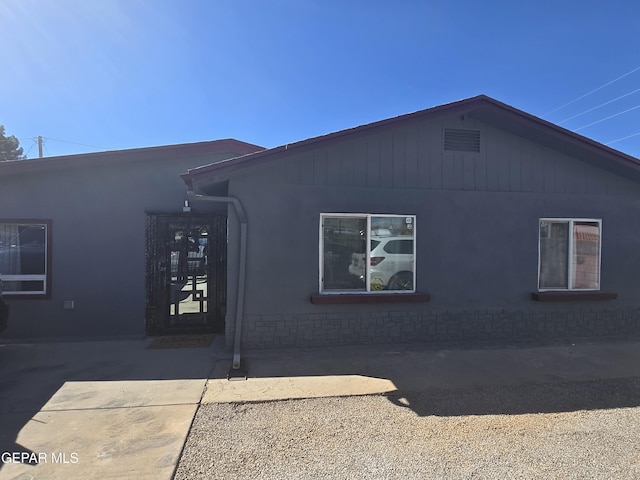 view of side of property with a patio area