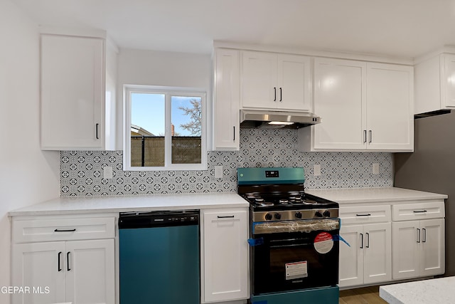 kitchen featuring white cabinetry, stainless steel appliances, and decorative backsplash