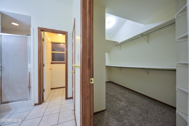 spacious closet featuring light tile patterned floors