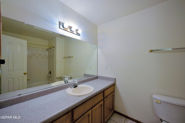 full bathroom with bathing tub / shower combination, vanity, tile patterned floors, and toilet