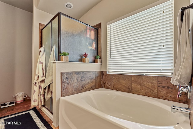 bathroom with separate shower and tub