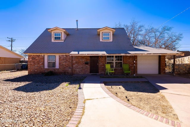 view of front of property featuring central AC unit and a garage