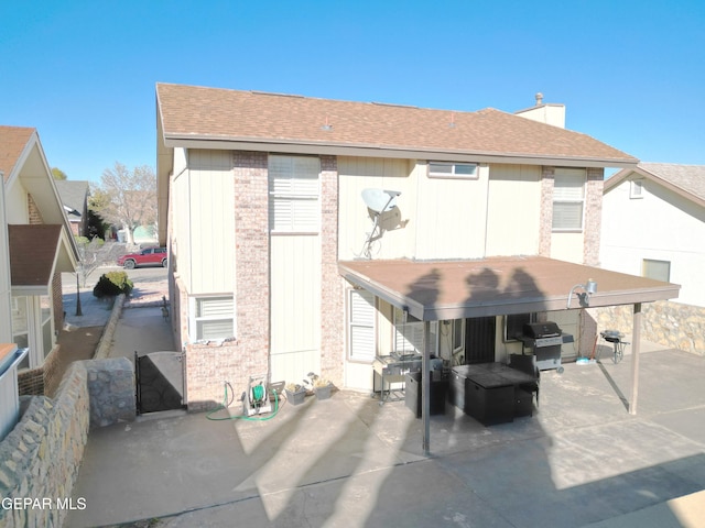 back of house with a patio area