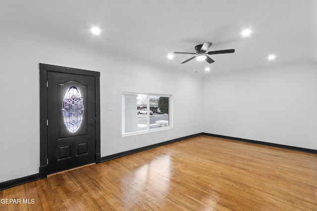 foyer entrance with hardwood / wood-style flooring, ceiling fan, and plenty of natural light