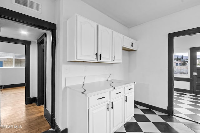 kitchen featuring white cabinetry