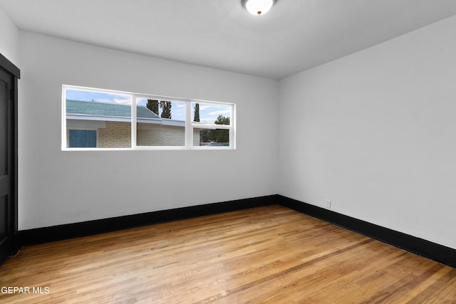 unfurnished room featuring light hardwood / wood-style flooring