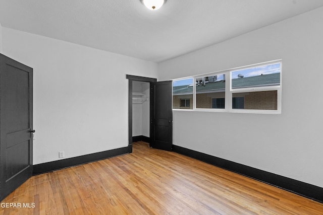 spare room featuring light hardwood / wood-style floors