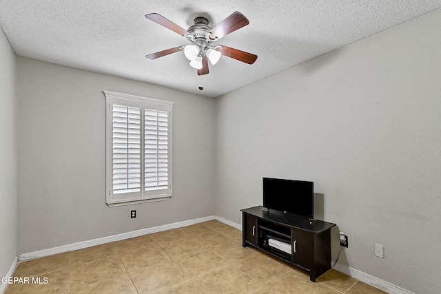 interior space with a textured ceiling and ceiling fan