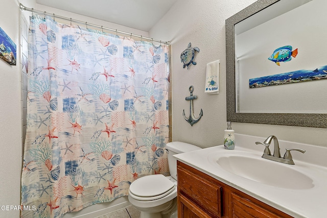 bathroom featuring vanity, toilet, and tile patterned flooring