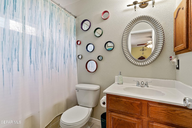 bathroom featuring walk in shower, vanity, and toilet