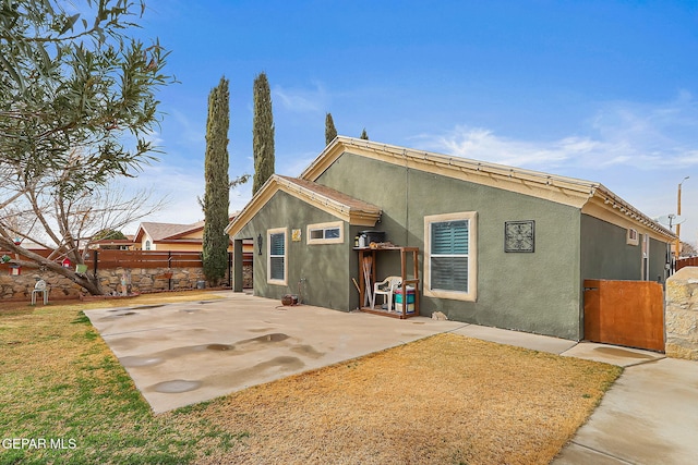 rear view of house with a patio