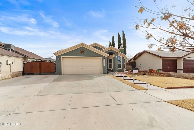 single story home featuring a garage and central air condition unit