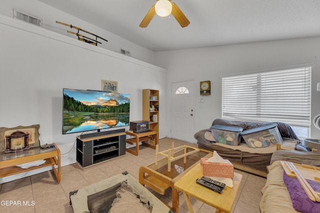 living room with ceiling fan and tile patterned flooring