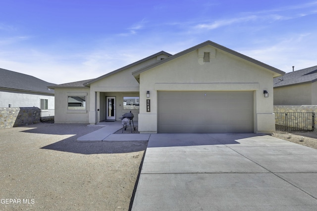 ranch-style house featuring a garage