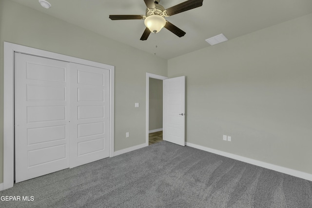 unfurnished bedroom featuring a closet, ceiling fan, and carpet floors