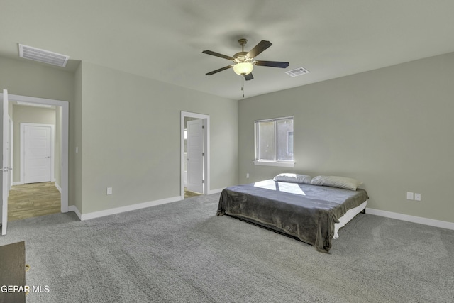 carpeted bedroom with ceiling fan