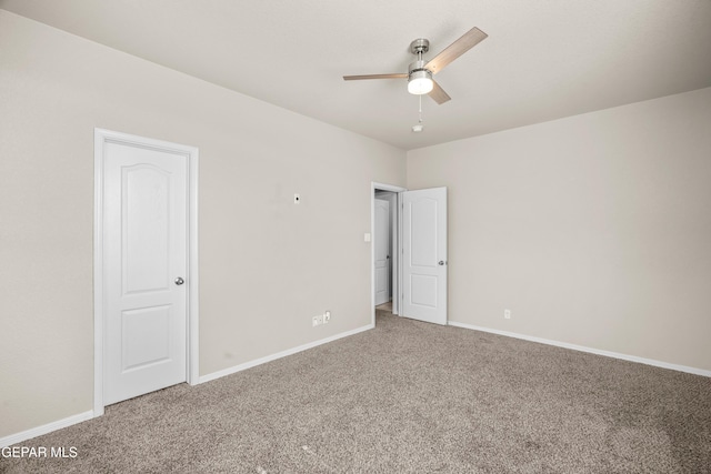 empty room with carpet and ceiling fan