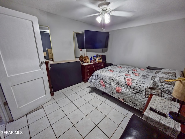 bedroom featuring light tile patterned floors and ceiling fan