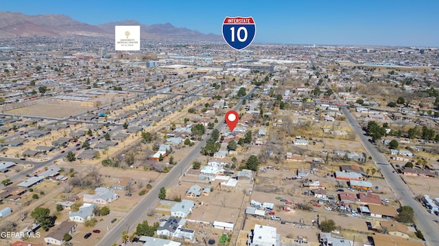 birds eye view of property with a mountain view