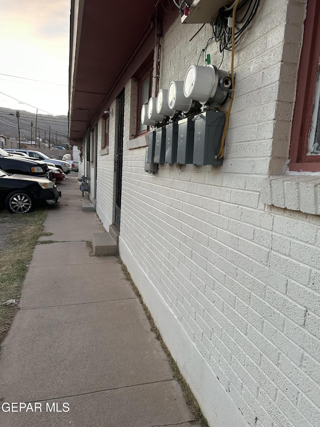 view of property exterior featuring brick siding