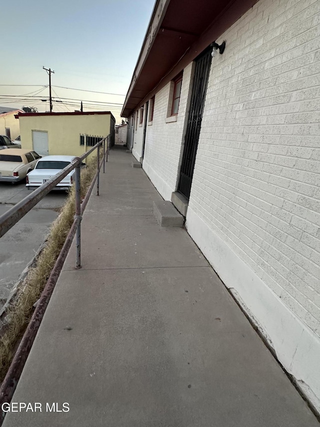 view of side of property featuring brick siding