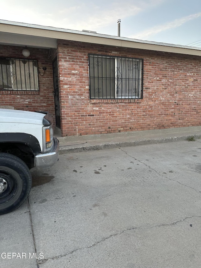 view of property exterior featuring brick siding