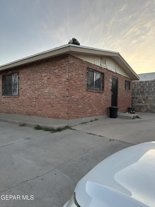 view of home's exterior with brick siding