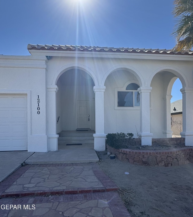 entrance to property featuring a garage