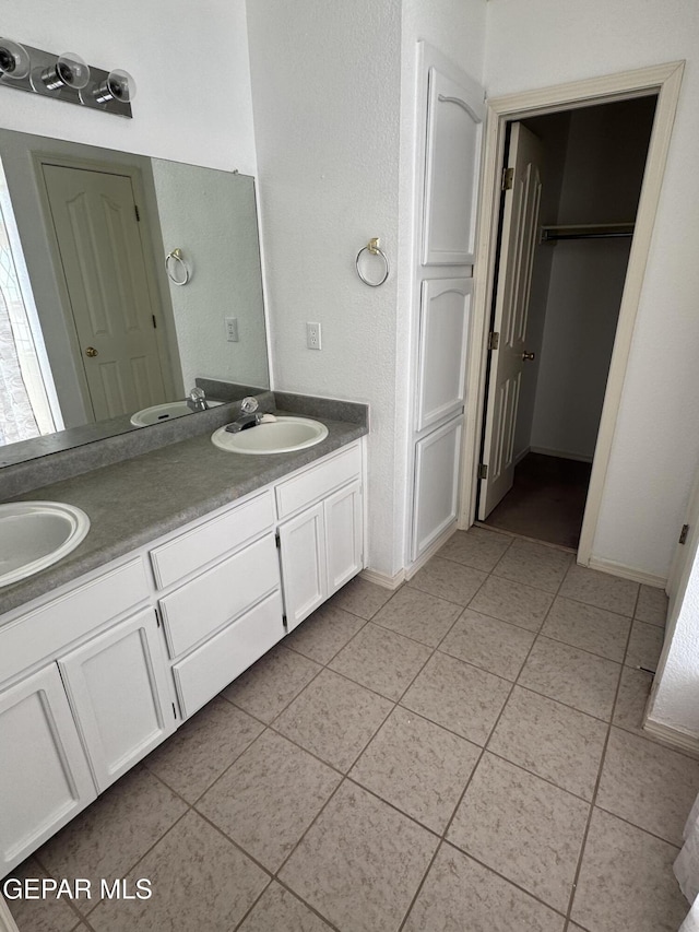 bathroom with vanity and tile patterned floors