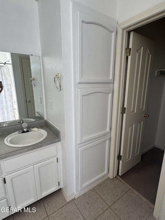 bathroom featuring vanity and tile patterned flooring