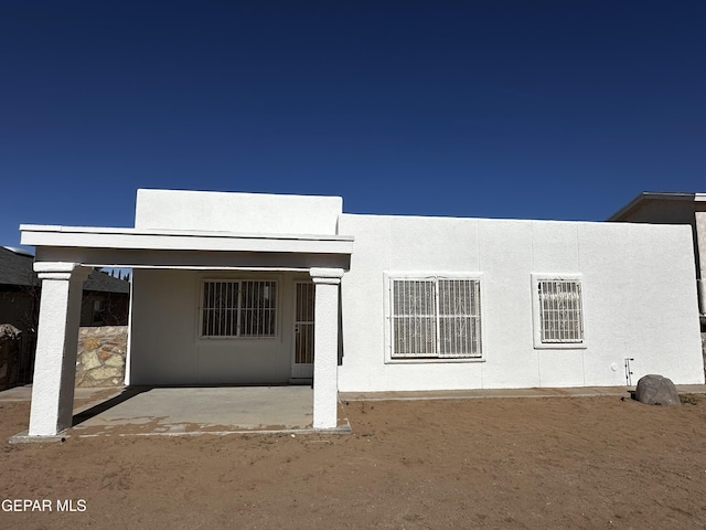 back of house with a patio area