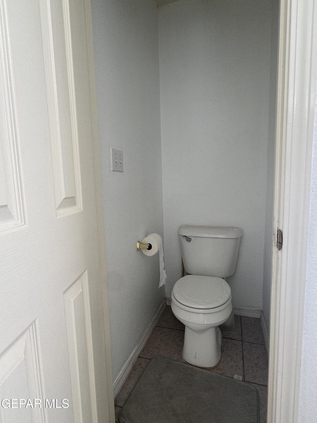 bathroom featuring tile patterned floors and toilet