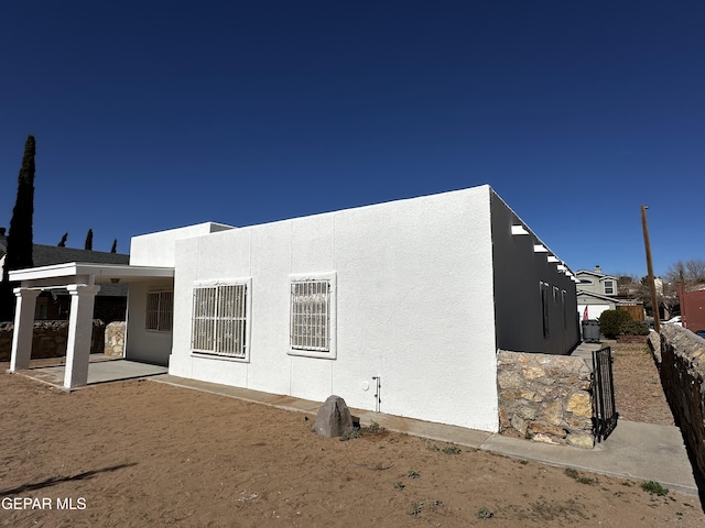 rear view of property featuring a patio