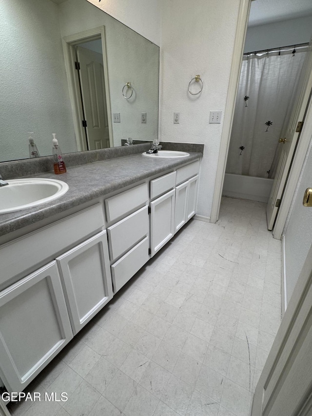 bathroom with vanity and shower / tub combo