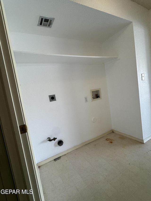 clothes washing area featuring hookup for a gas dryer, washer hookup, and hookup for an electric dryer