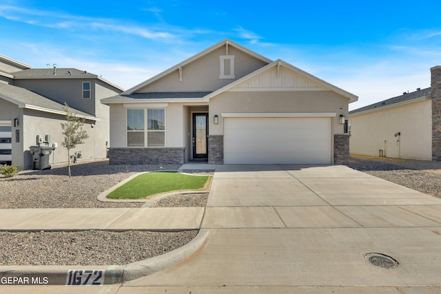 view of front of property featuring stucco siding, concrete driveway, an attached garage, board and batten siding, and stone siding