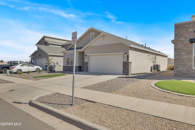 craftsman house with driveway, stone siding, an attached garage, central AC, and stucco siding