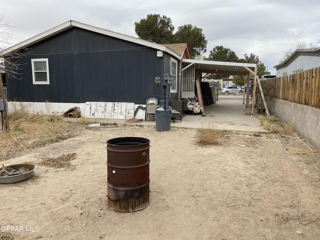 view of property exterior featuring fence