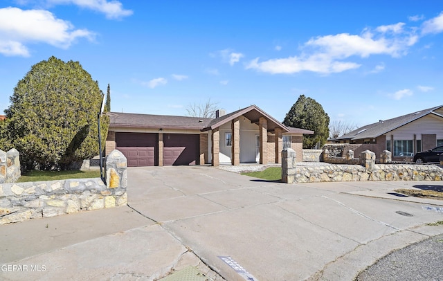 single story home featuring a garage