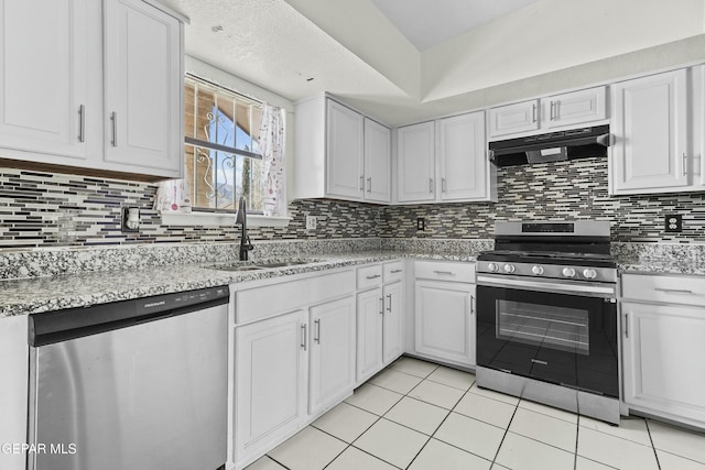 kitchen featuring appliances with stainless steel finishes, sink, tasteful backsplash, and white cabinets