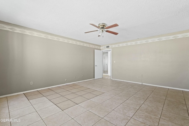 unfurnished room featuring ceiling fan and a textured ceiling