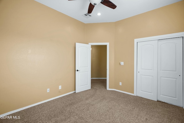 unfurnished bedroom featuring visible vents, baseboards, a ceiling fan, carpet flooring, and a closet