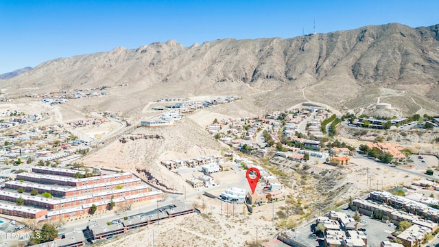 birds eye view of property featuring a mountain view