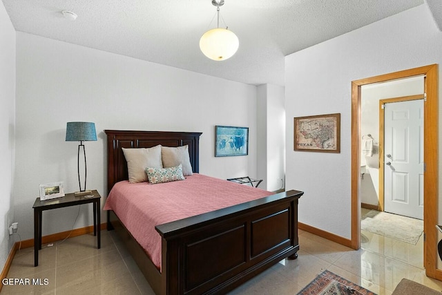 tiled bedroom with a textured ceiling