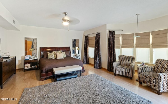 bedroom featuring light hardwood / wood-style flooring and ceiling fan